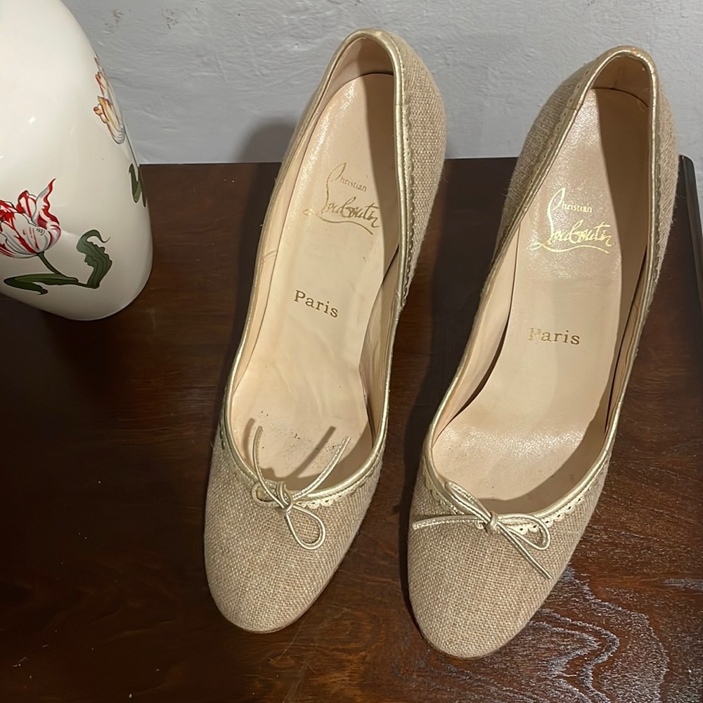 Christian Louboutin tan and gold heels.